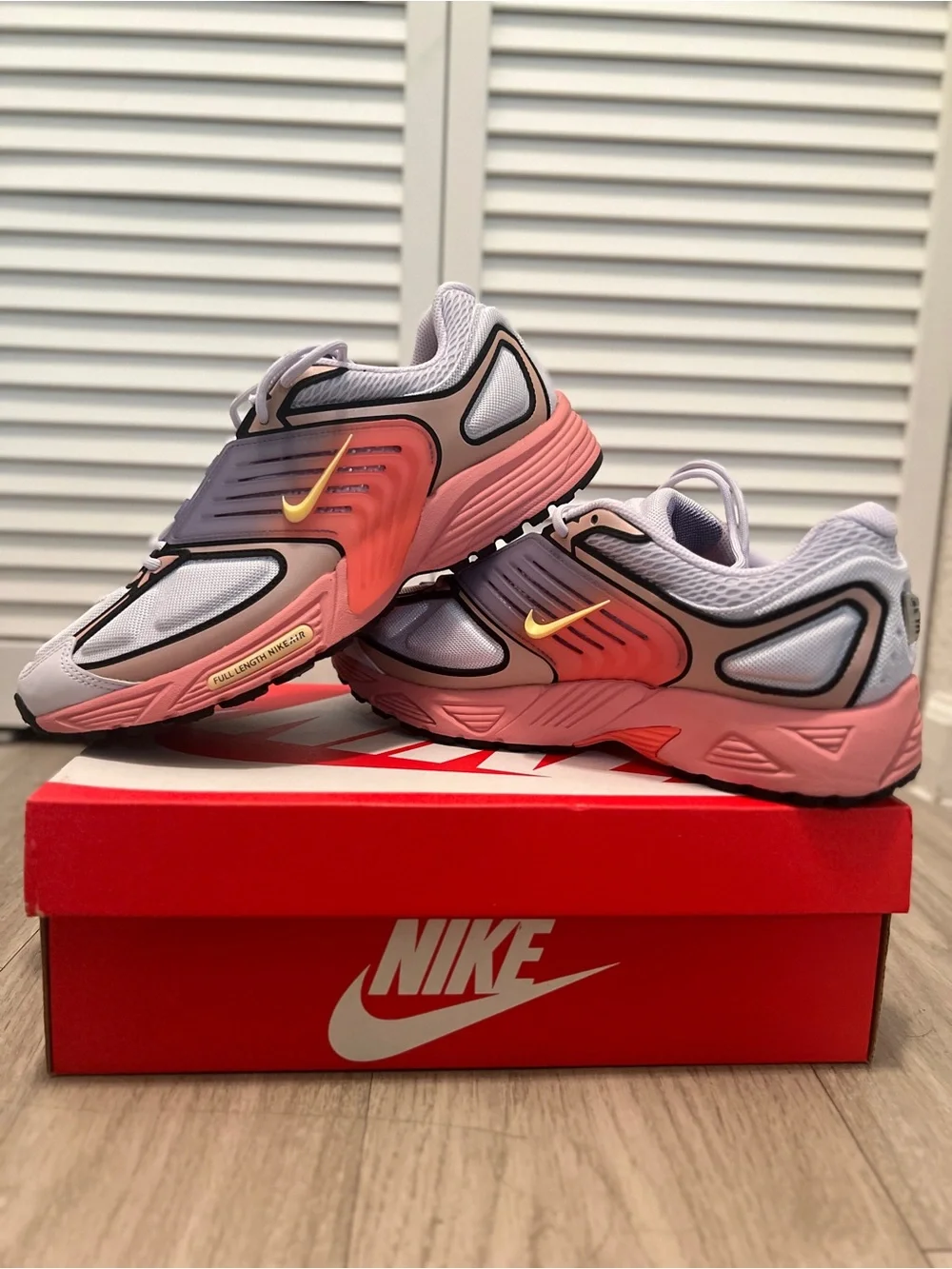 Nike men’s Pink and Gray Sneakers with Yellow Swoosh